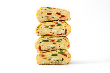 Traditional tamagoyaki Japanese omelette isolated on white background