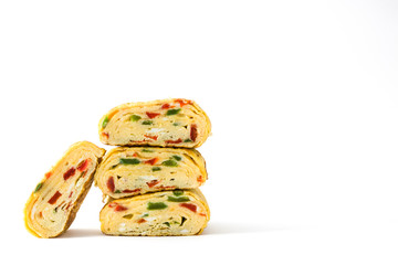 Traditional tamagoyaki Japanese omelette isolated on white background