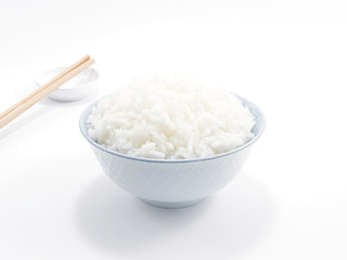 Rice in a bowl with chopsticks isolated