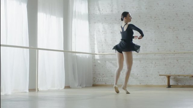  Gorgeous Young Ballerina Doing Pirouette in Slow Motion. Shot in a Bright Modern Studio on a Sunny Day. Shot on RED EPIC-W 8K Helium Cinema Camera.