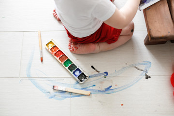 smutty kid  with watercolor paints