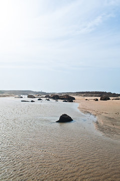 Dreamlike view of beach and rocky mountains