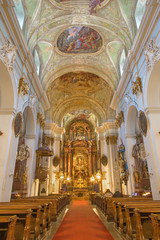 Fototapeta na wymiar VIENNA, AUSTRIA - DECEMBER 19, 2016: The nave of baroque church Mariahilfer Kirche.