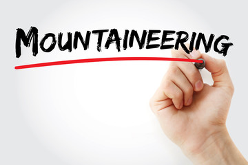 Hand writing Mountaineering with marker, sport concept background