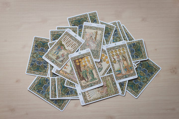 Tarot cards on wooden background.