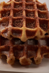 Belgian waffles with grated chocolate isolated