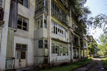 Fototapeta na wymiar Abandoned mining ghost-town Polyana, Abkhazia. Destroyed empty houses 