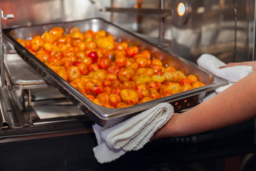 professional Baked sweet potatoes making oven cooking.