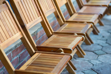 Fototapeta na wymiar Wooden chairs in row