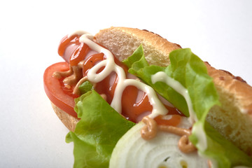 sandwich with sausage and vegetables isolated