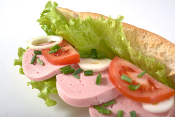 sandwich with sausage and vegetables isolated