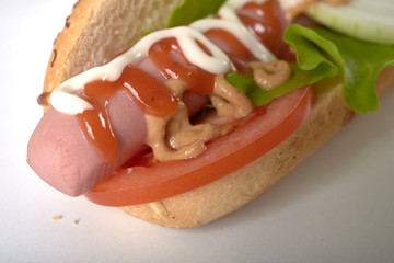 sandwich with sausage and vegetables isolated