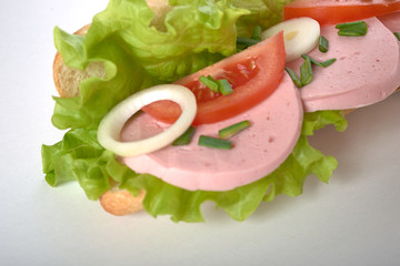 sandwich with sausage and vegetables isolated