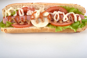 sandwich with sausage and vegetables isolated