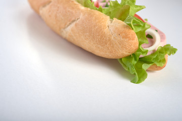 sandwich with sausage and vegetables isolated