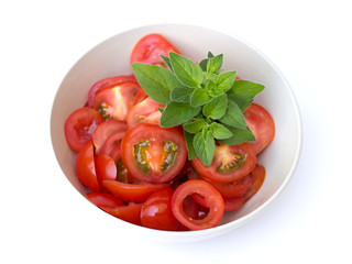 tomatoes in a bowl on a white background