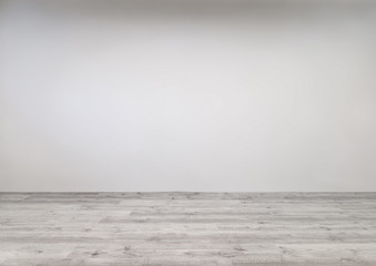 Gekälktes Laminat mit frisch gestrichener Wand in leerem Raum - 133933334