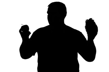 silhouette of a man with obesity choosing between an apple and a