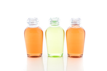 Orange and green bottle of shampoo, gel, soap