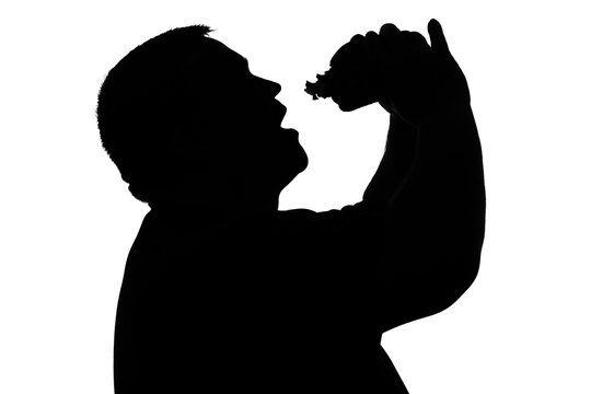 Silhouette Of A Man With Overweight Eating Hamburger