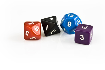 Colored dice isolated on white background. Still life picture taken in studio with softbox.