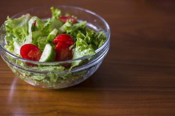 Green healthy salad with little tomatoes and salad leaves.