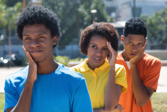 Group of three sad african american young adults