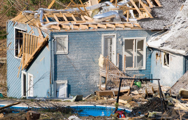 tornado damaged Wood Frame house