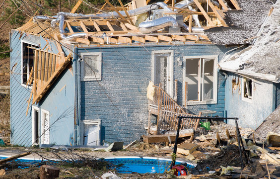 tornado damaged Wood Frame house