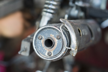 Closed up old motorcycle exhaust pipe