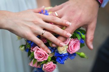 Beautiful wedding bouquet in hands of the bride