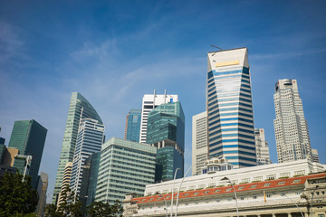 Fototapeta na wymiar High buildings in Singapore on blue sky background