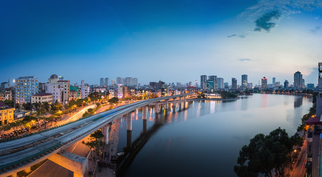 Aerial view of Hanoi cityscape by twilight period, with Dong Da lake and under construction Cat Linh - Ha Dong elevated railway