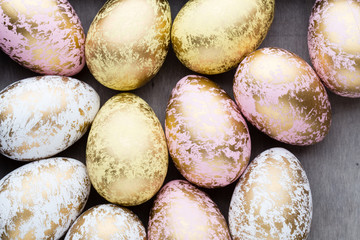 Easter eggs painted in colors on a pattern background.