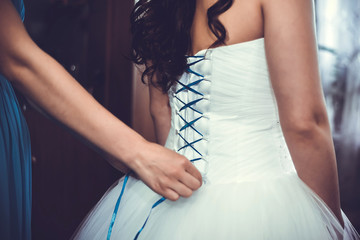 Morning training and a beautiful young bride for the wedding. Tightening corset wedding dress.