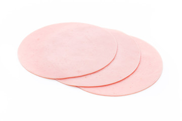Sliced boiled ham sausage isolated on white background, top view