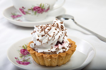 Cake topped with grated chocolate.