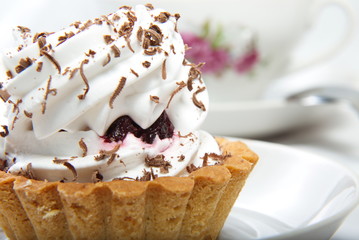 Cake topped with grated chocolate.