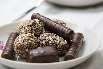 Chocolate candy on the saucer.