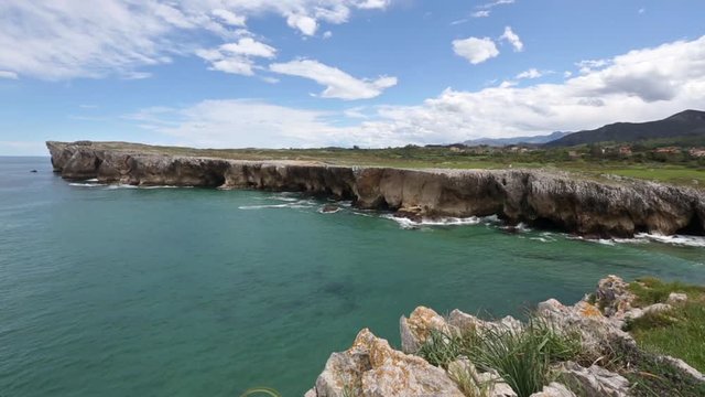 Atlantic rocky coast near Guadamia beach (or Aguamia) summer scenery, Asturias, Spain.
