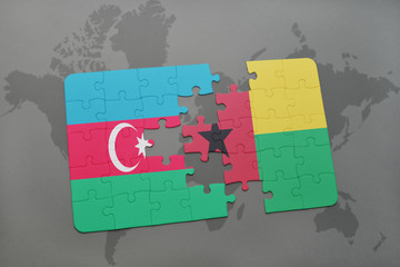 puzzle with the national flag of azerbaijan and guinea bissau on a world map