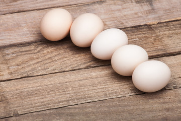 The eggs on a wooden table.