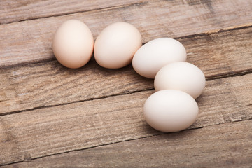 The eggs on a wooden table.