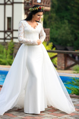 Fototapeta premium Beautiful bride in a dress. The concept of love and marriage.