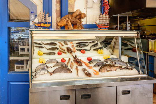 Fresh seafood served at Greek restaurant in Rethymno city on Crete island. Europe.