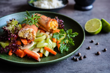 Roasted turkey breasts rolls stuffed with egg, Feta cheese, pepper and parsley, served with rice and steamed vegetable