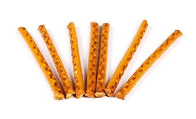 salty cracker pretzel sticks isolated on white background