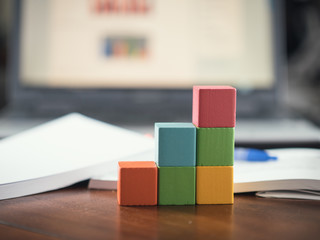 building blocks cubes against blur laptop background