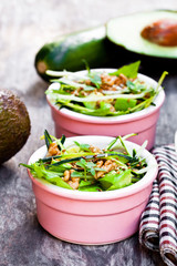 Healthy  green vegetarian salad with zucchini spaghetti and avoc