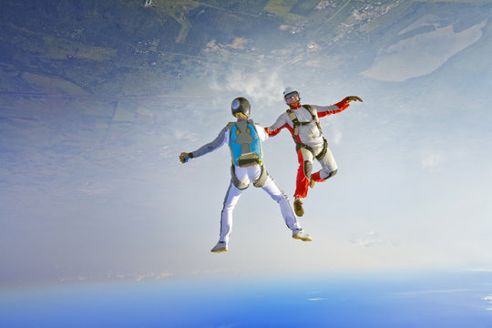 Two Skydivers Falling Upside Down